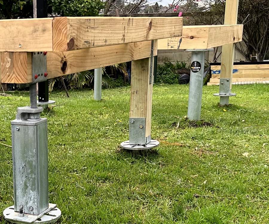 Adjustable jack post, timber post in a stirrup and a pile shaft run direct, all carrying one bearer